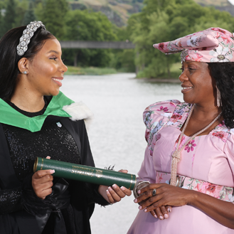 two people celebrating on graduation day