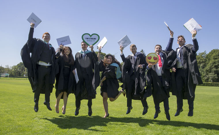 students celebrating graduation