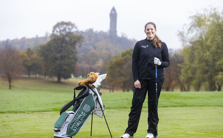 Golfer in front of Wallace Monument