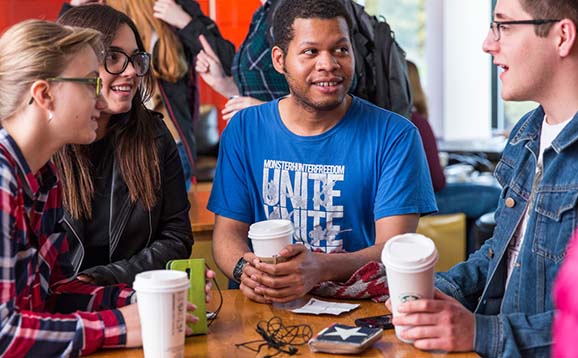 Students drinking coffee at Underground, Students' Union.