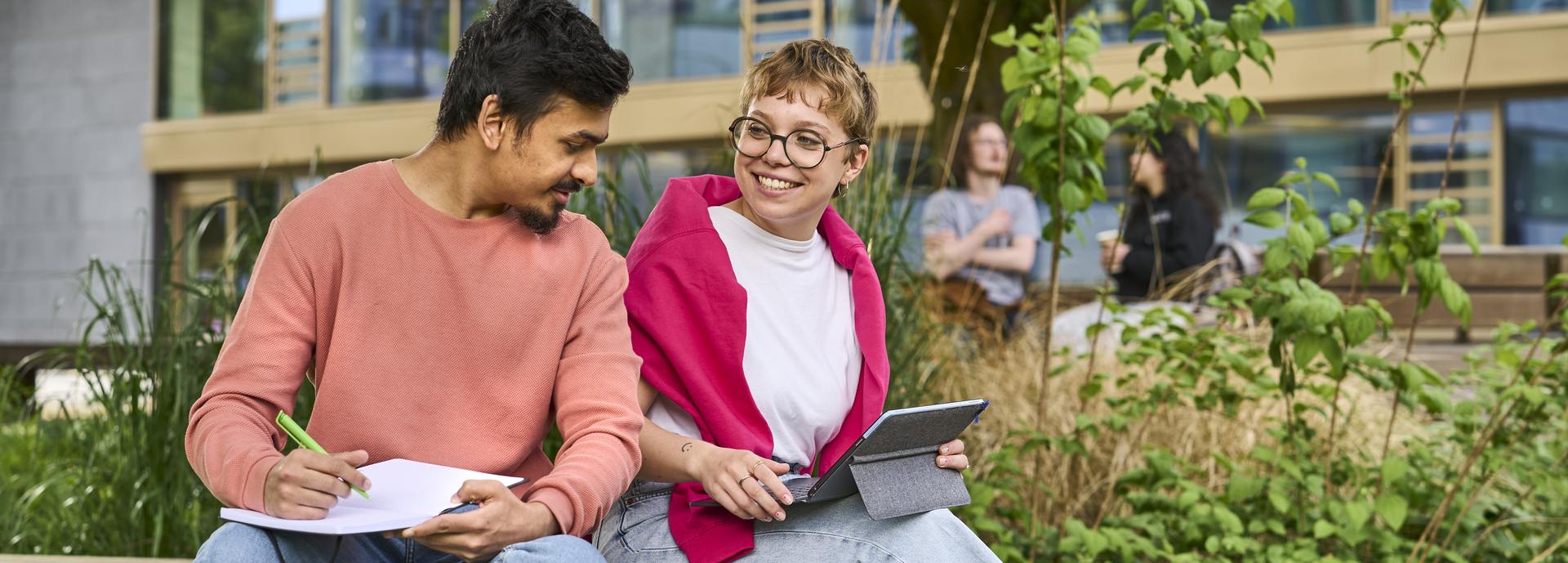 Students looking at a tablet