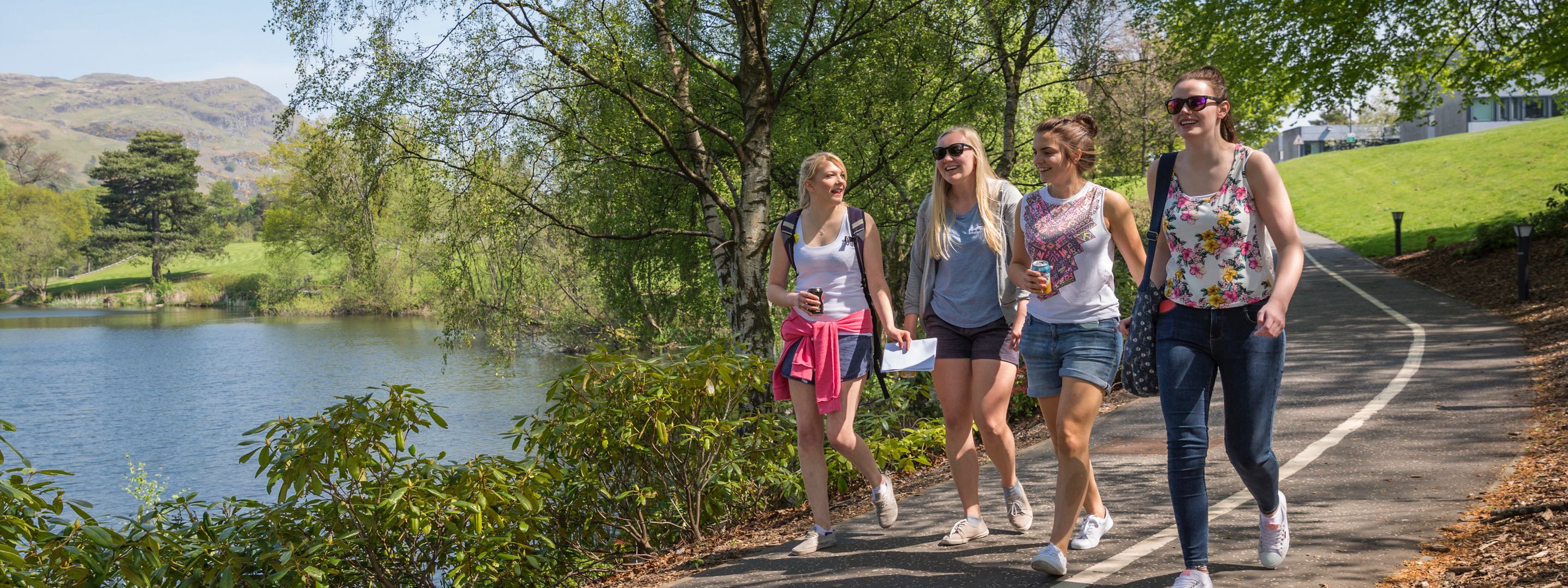 Group of students walking by the loch