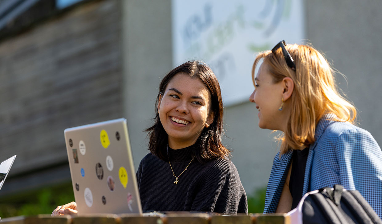 Two happy students outside the Student's Union