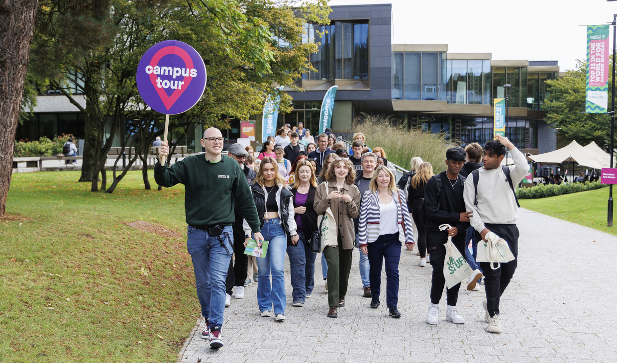 A student ambassador leading a campus tour