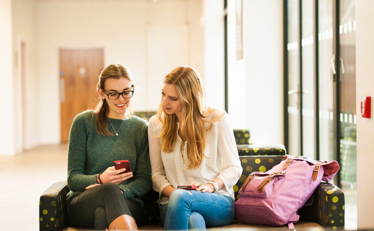 Students looking at their mobile phone