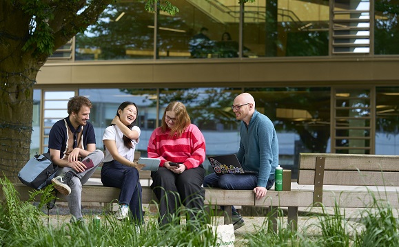 Group of students sitting on a bench