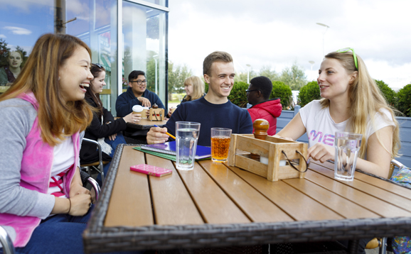 students eating and drinking