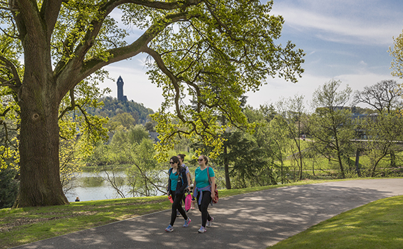 Students walking around airthrey loch