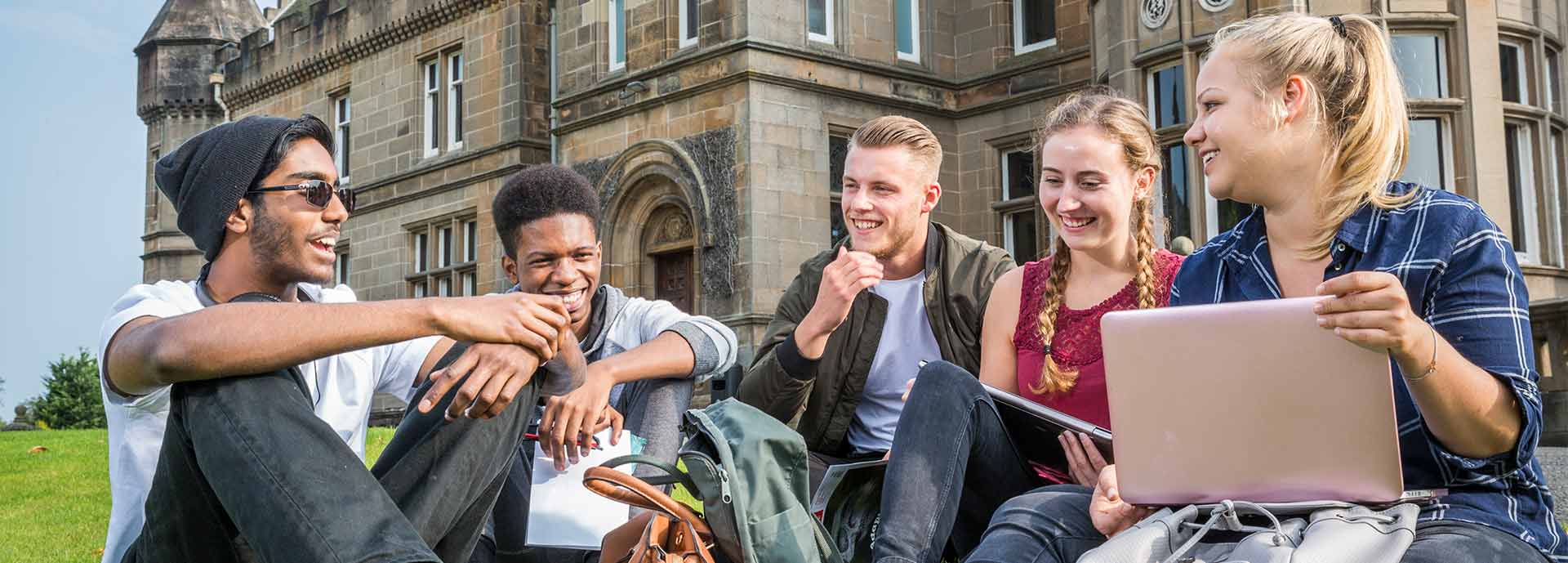 University of Stirling students socialising outside Airthrey Castle.