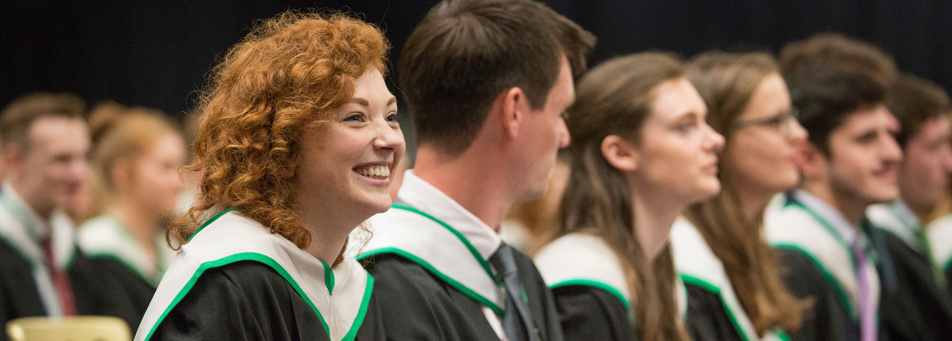 student smiling at graduation