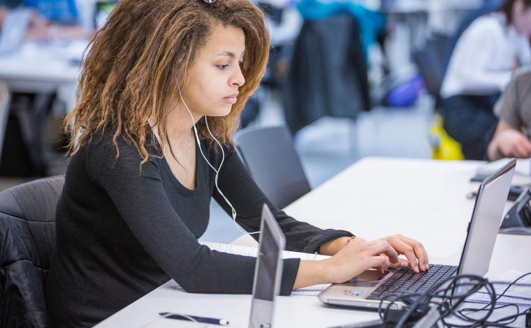 Student working at a laptop