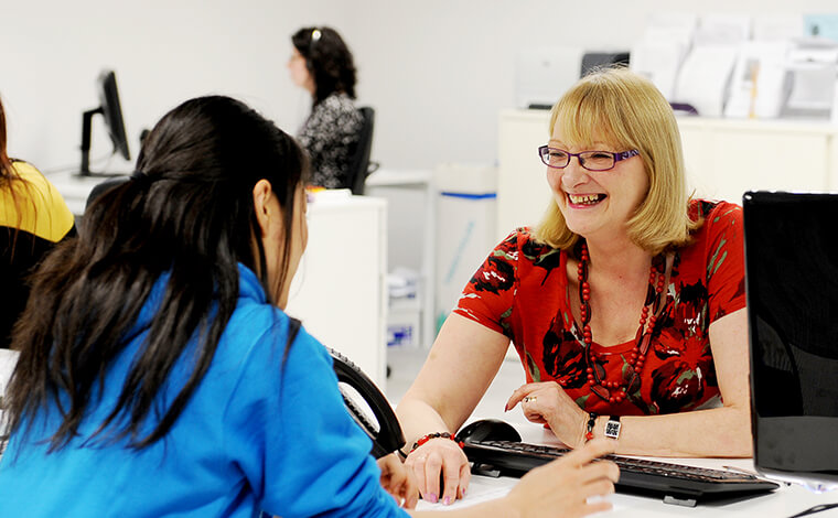 Student talking to member of staff