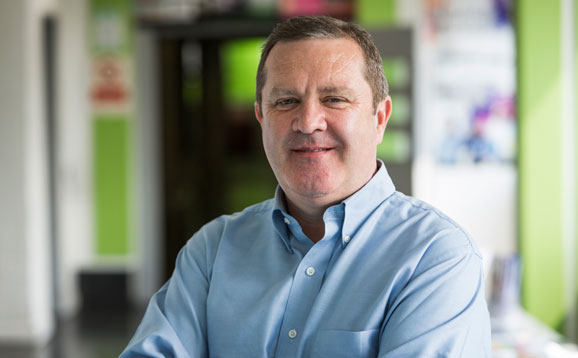 Graeme Hendry, a mature student confidently smiling into the camera