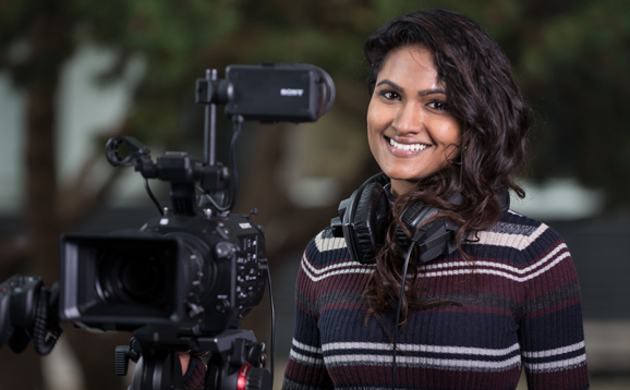 student with video camera