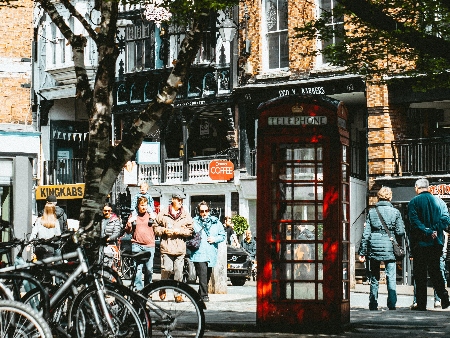 people in street outside shops