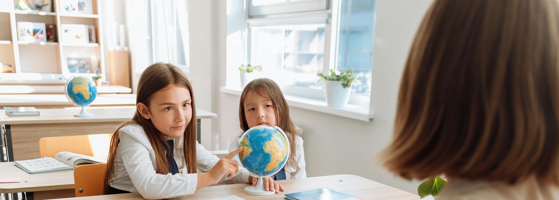 pupils and teacher in classroom