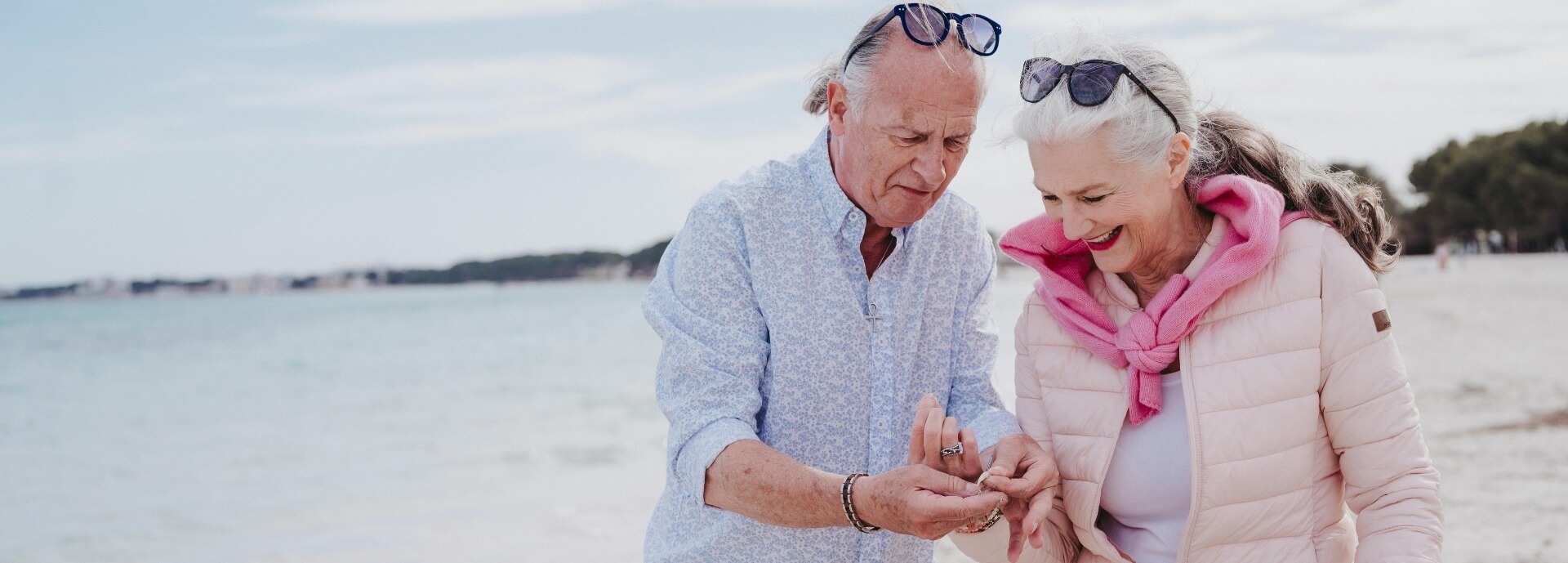 older man and older woman on beach