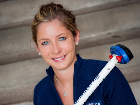 Head shot of Eve Muirhead holding curling brush