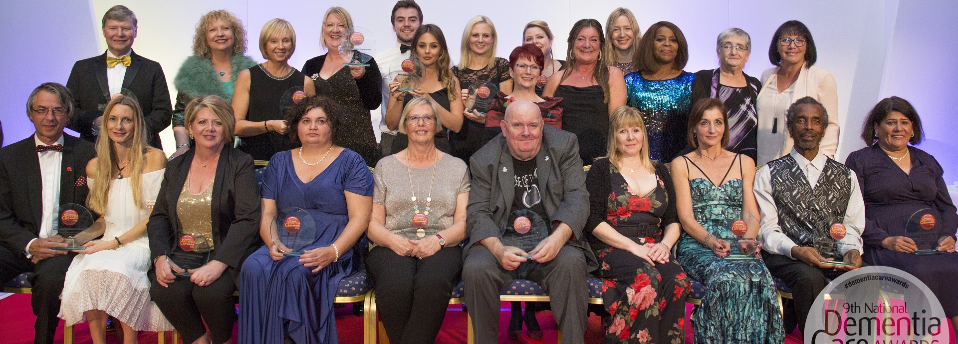 group of award winners in evening dress