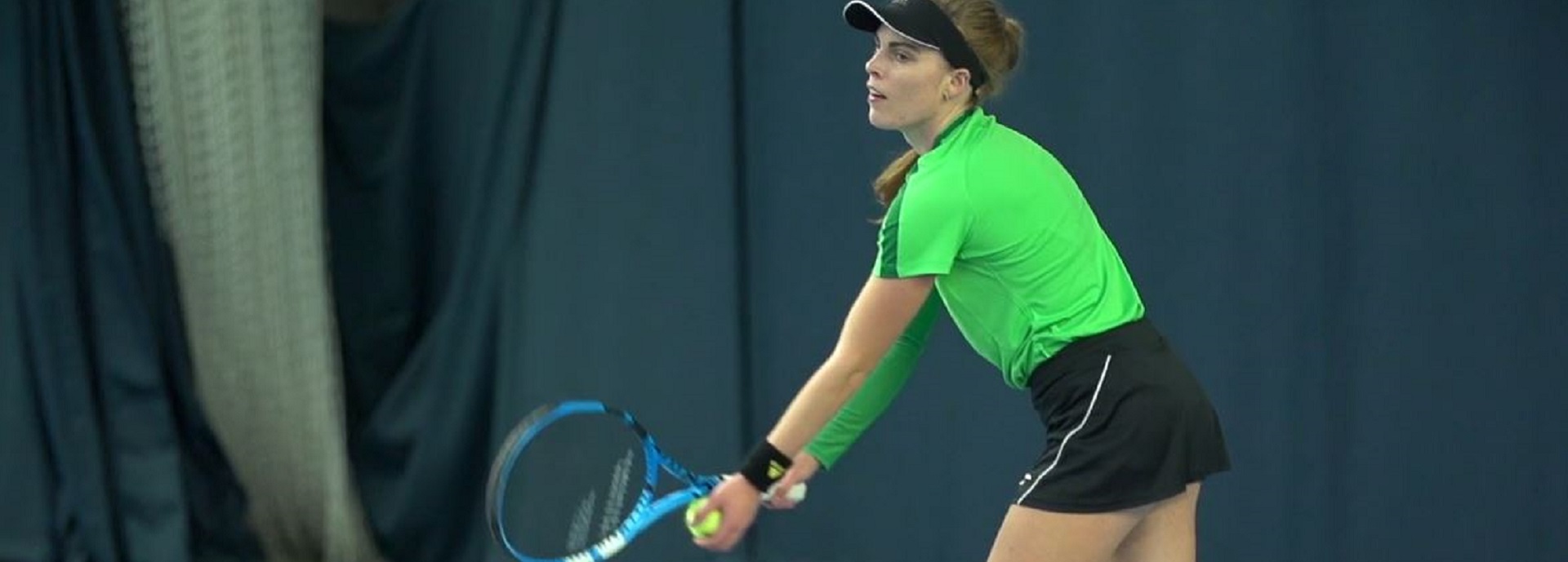 female tennis player preparing to serve