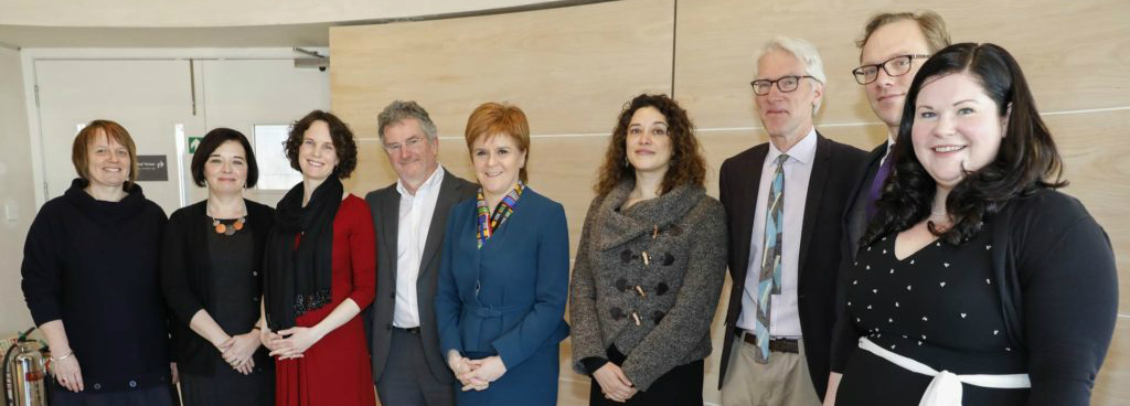 A group of people standing in a line, this is the advisory group on human rights leadership 