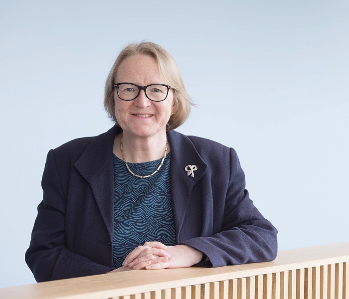 head shot of woman with glasses