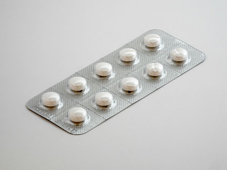 Strip of tablets in packaging