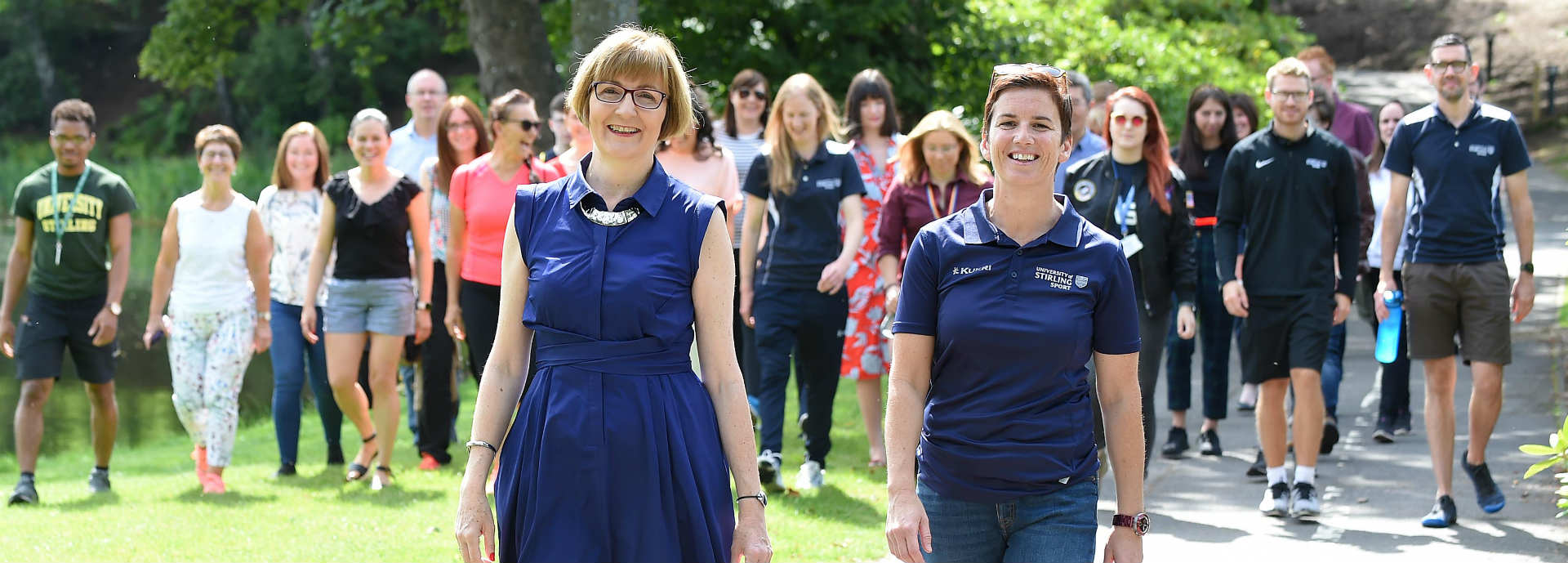 The University’s Professor Maggie Cusack, Dean of the Faculty of Natural Sciences, and Cathy Gallagher, Executive Director of Sport, lead participants on a final celebratory walk around Campus