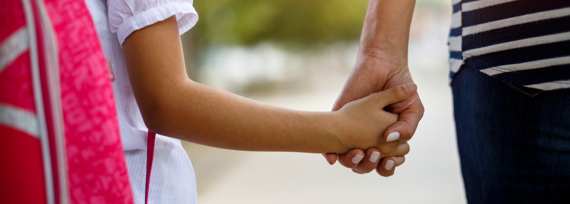 Two children holding hands