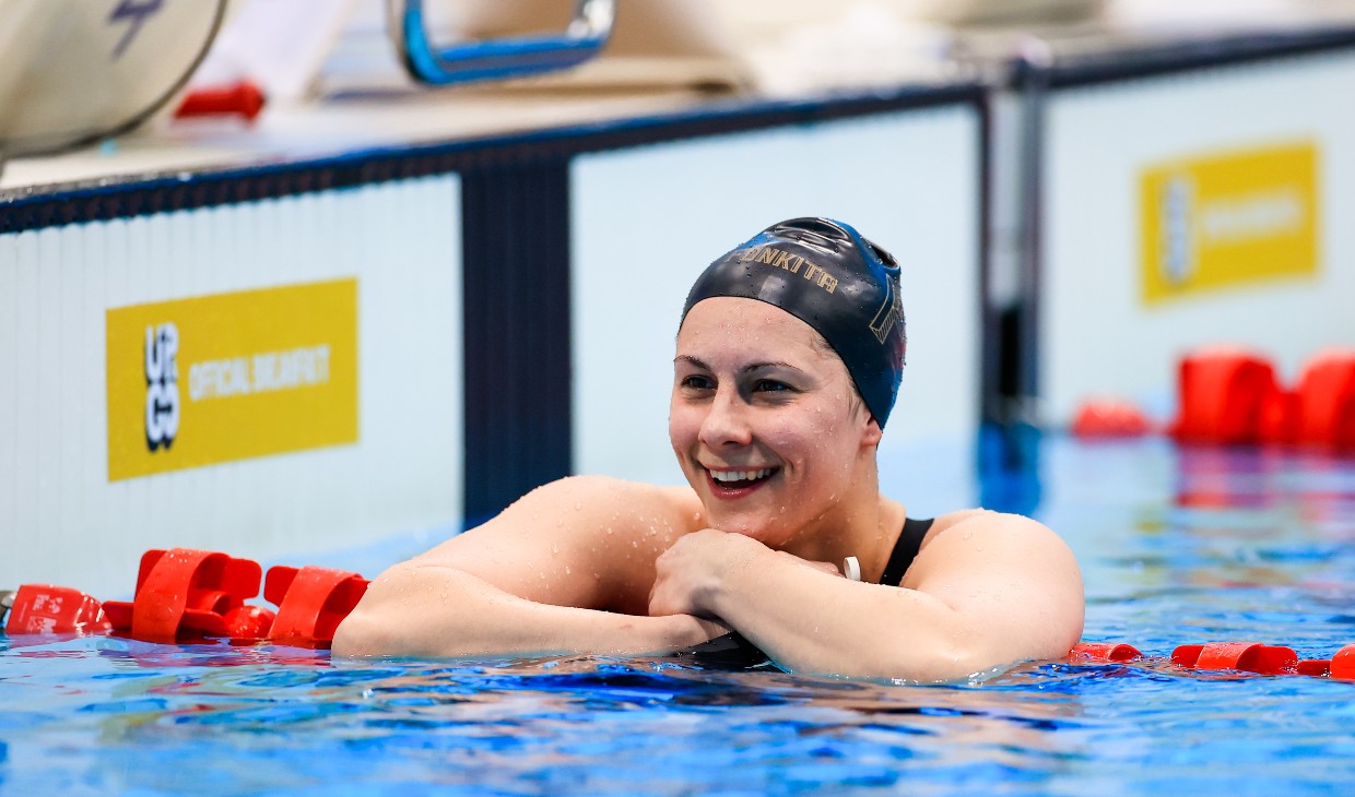 Aimee Willmott celebrates in the pool