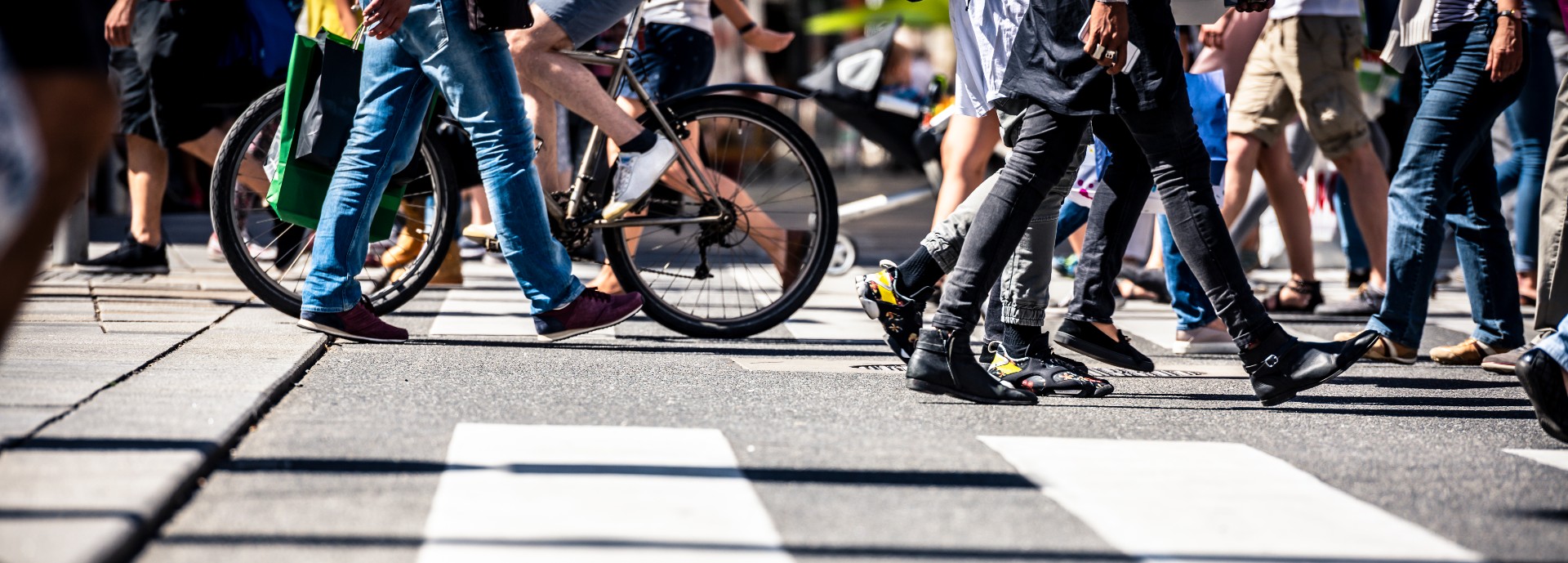 Busy street scene showing zebra crossings, pedestrians and bicycles