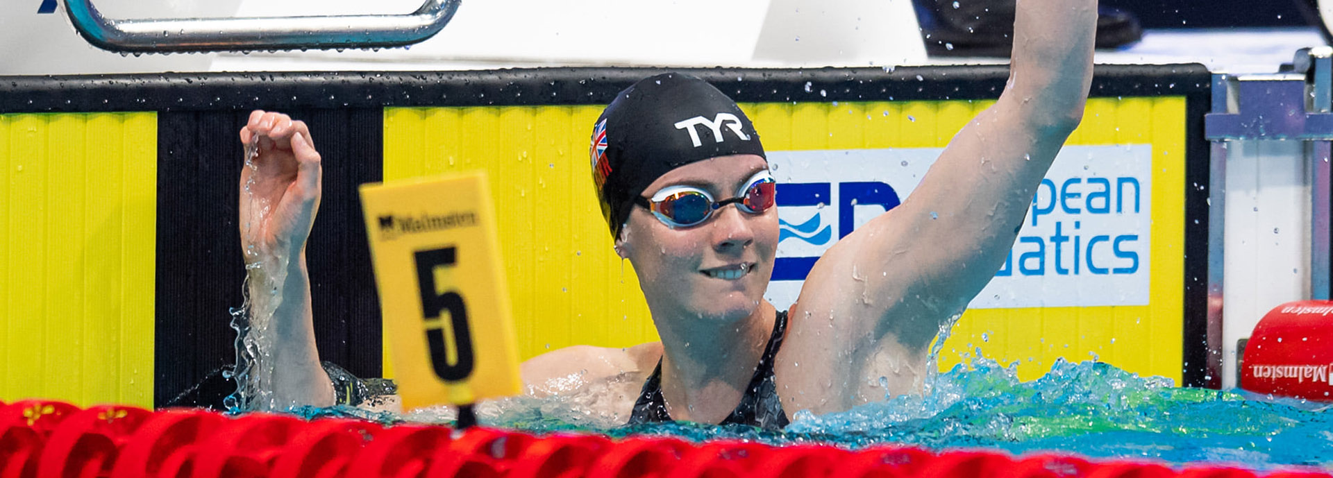 Kathleen Dawson celebrating in pool