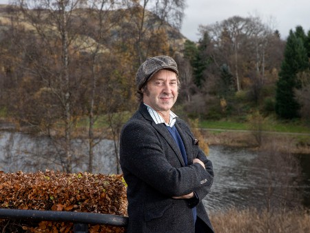 Profile picture of Prof Simon MacKenzie by the Stirling campus loch