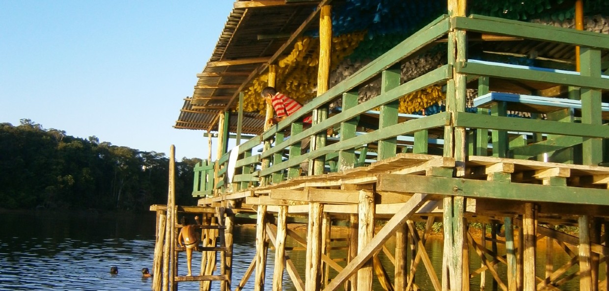 Wooden restaurant on stilts in water