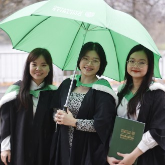 University of Stirling winter graduates celebrating - p8s