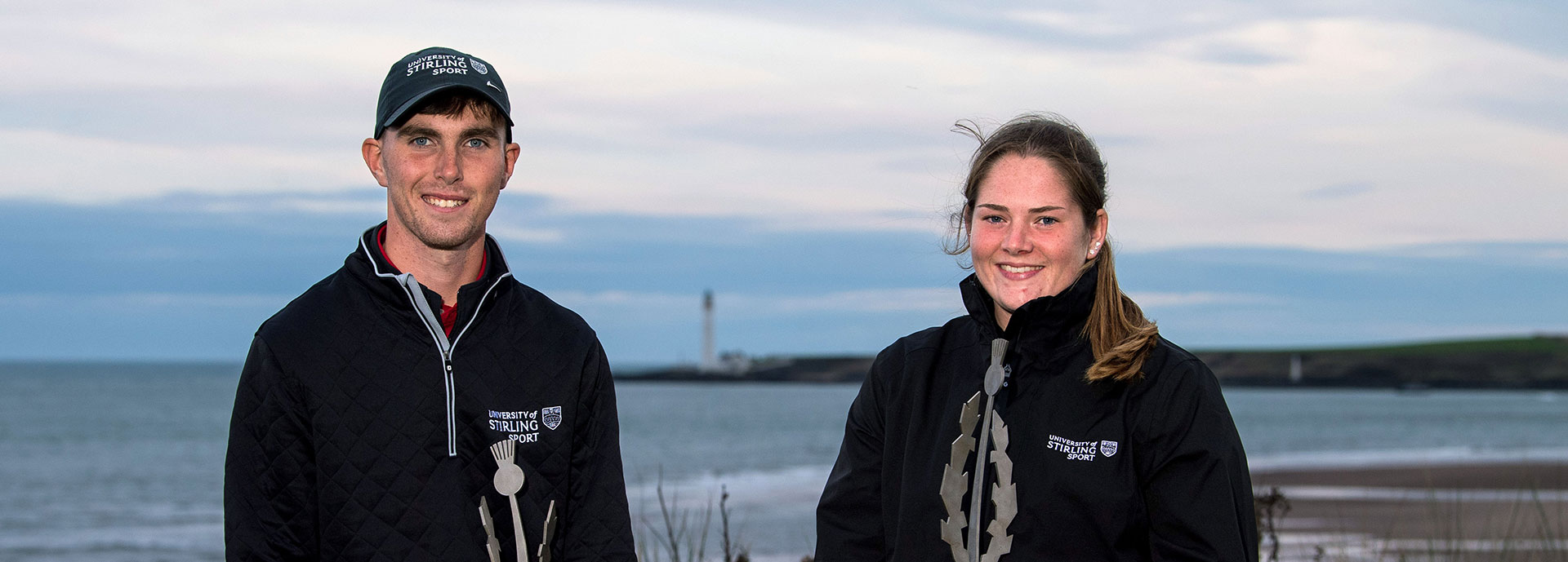 Stirling golfers George Cannon and Lorna McClymont pose for a photo with their trophies