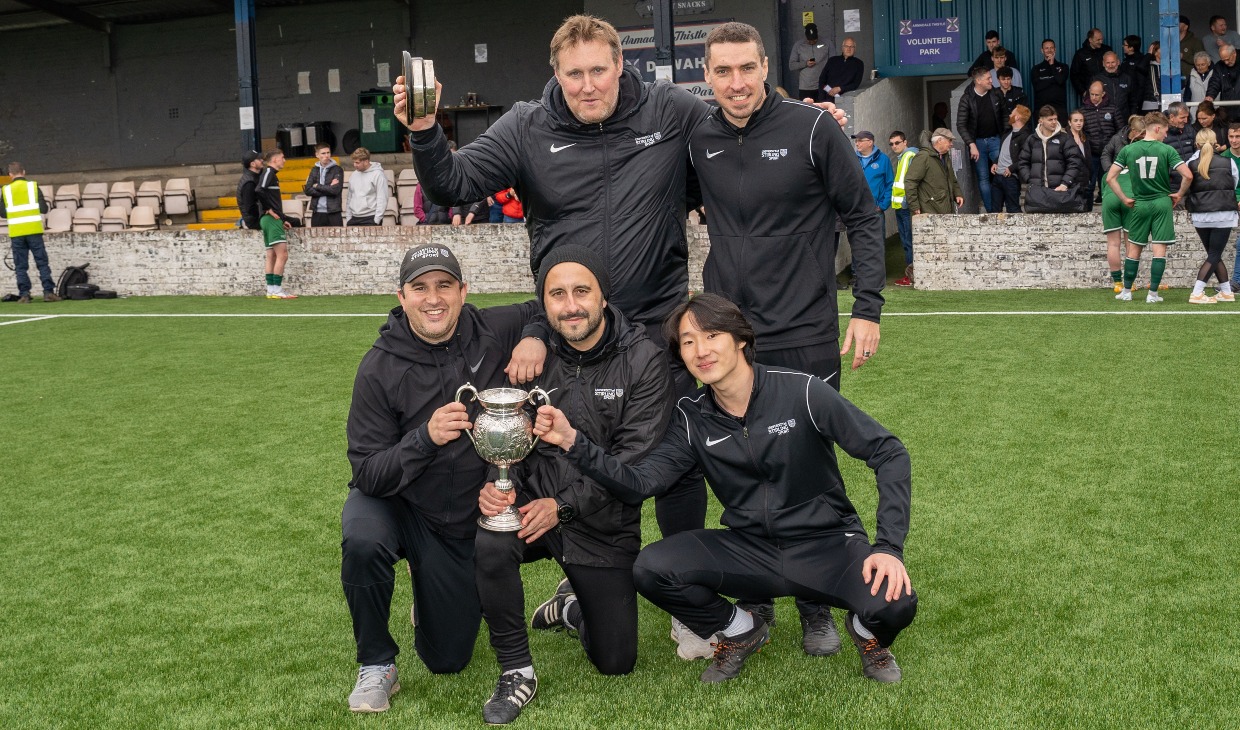 University of Stirling coaching staff celebrate the football team's win.