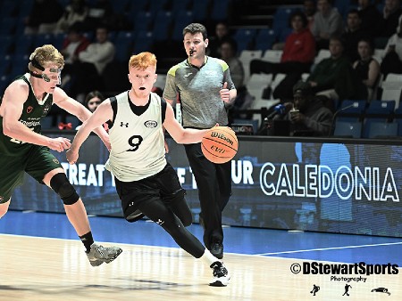 A University of Stirling basketball player in action on the court