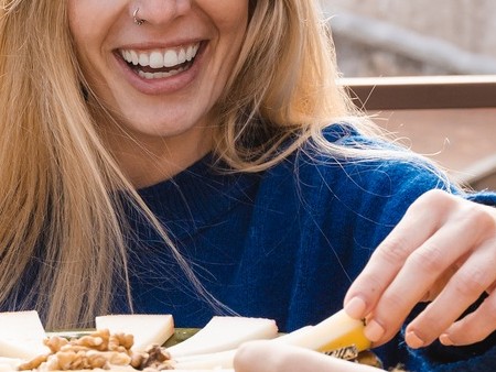 Person eating cheese