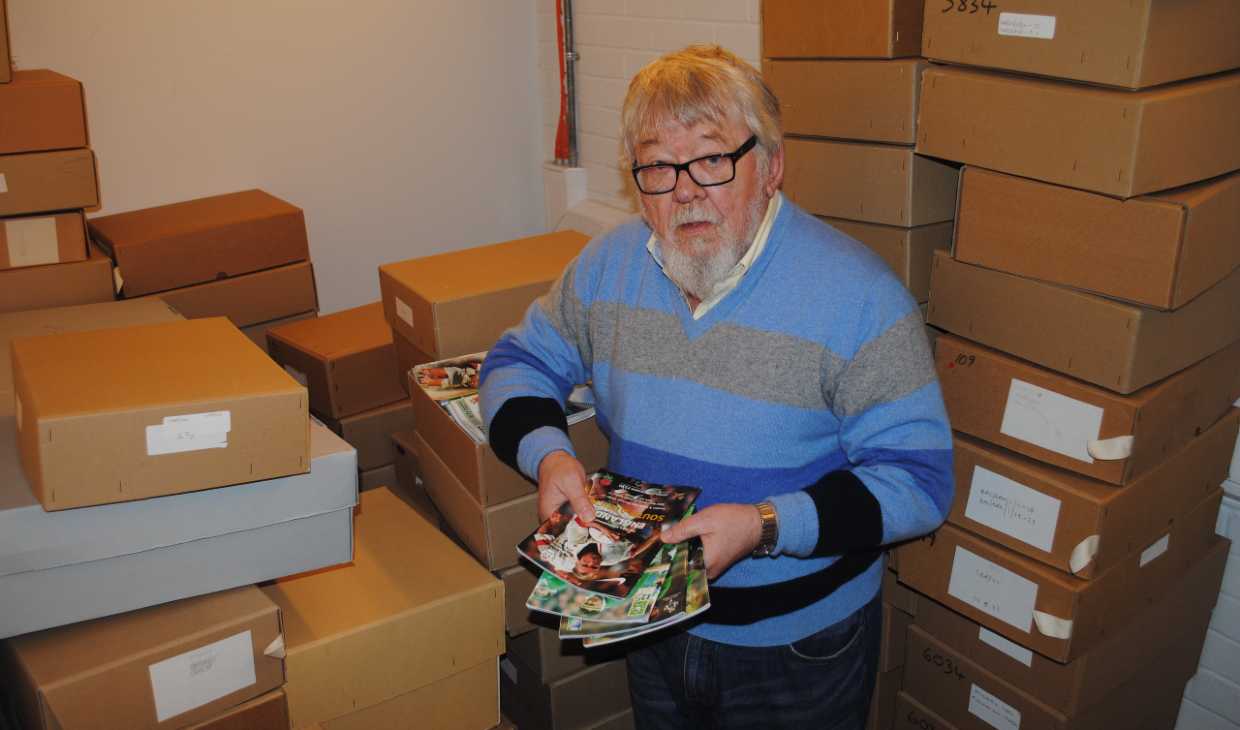 Scottish historian Dr Murray Watson surrounded by boxes of archive materials