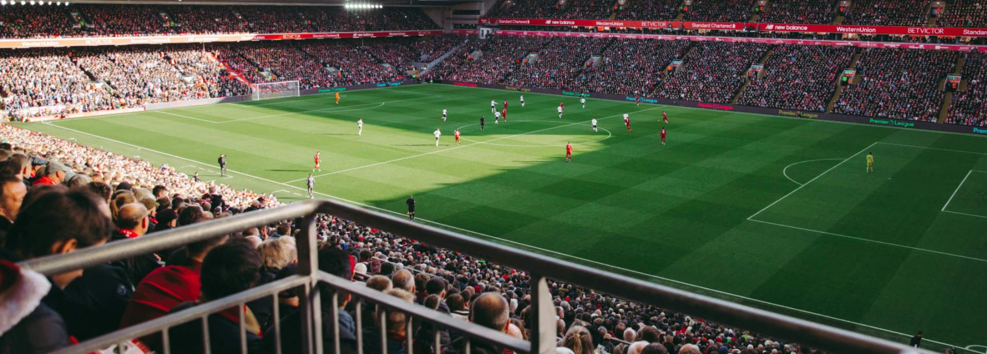 football pitch with spectators on stands