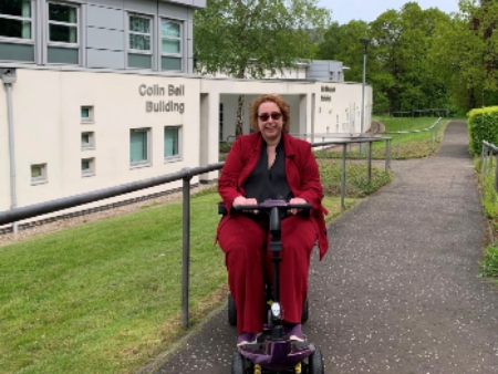 Woman in disability scooter