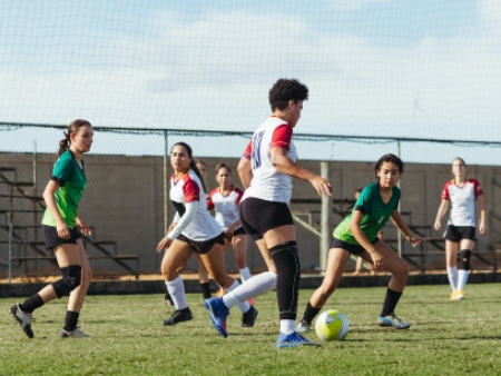 women playing football