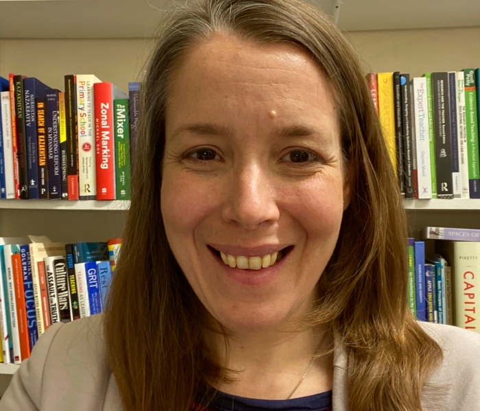 woman in front of books