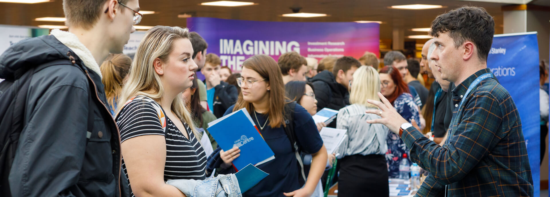 Students at a career fair stall