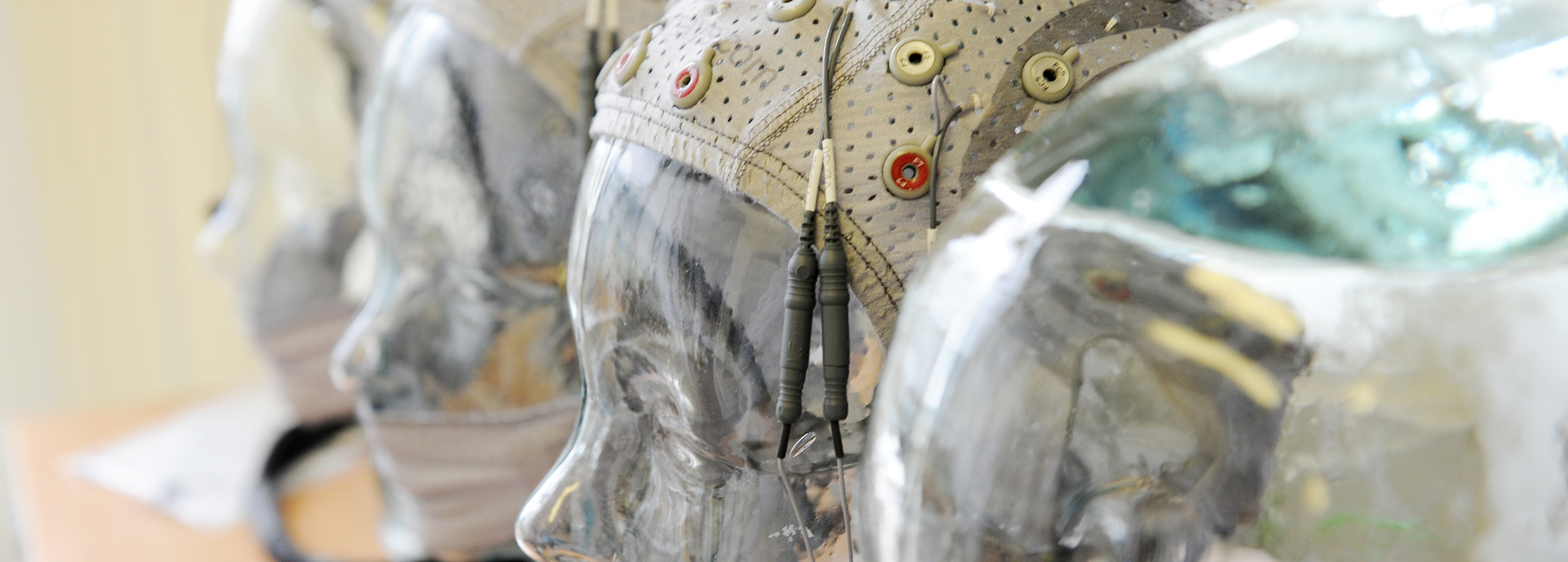 Row of transparent heads with headsets