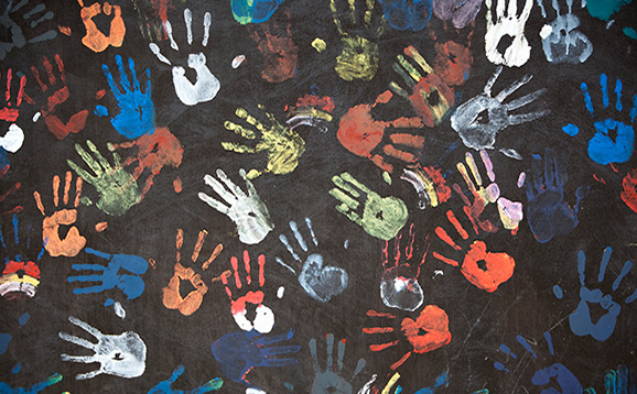 Children handprints on a wall