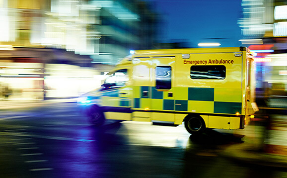 Ambulance speeding through city street