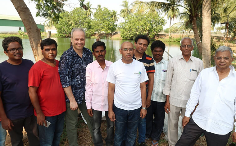 Group photo of staff from IMAG and Ananda Group team